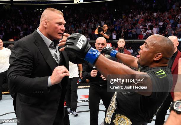 Daniel Cormier confronts Brock Lesnar after his UFC heavyweight championship fight during the UFC 226 event inside T-Mobile Arena on July 7, 2018 in...