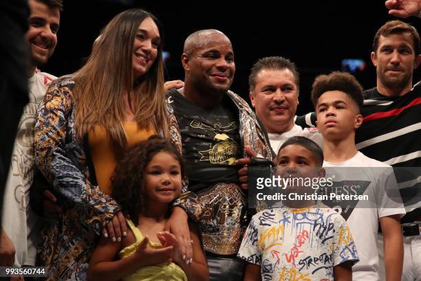 Daniel Cormier celebrates with family inside the Octagon after his UFC heavyweight championship fight during the UFC 226 event inside T-Mobile Arena...