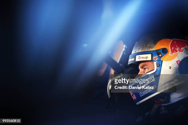 Shane Van Gisbergen driver of the Red Bull Holden Racing Team Holden Commodore ZB looks on during the top ten shoot out for race 18 of the Supercars...