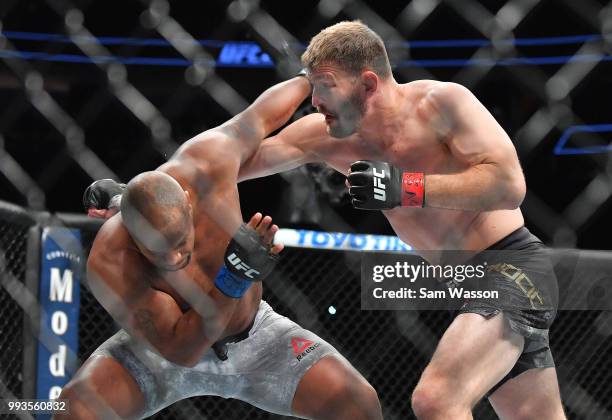 Stipe Miocic throws a punch against Daniel Cormier during their heavyweight championship fight at T-Mobile Arena on July 7, 2018 in Las Vegas,...