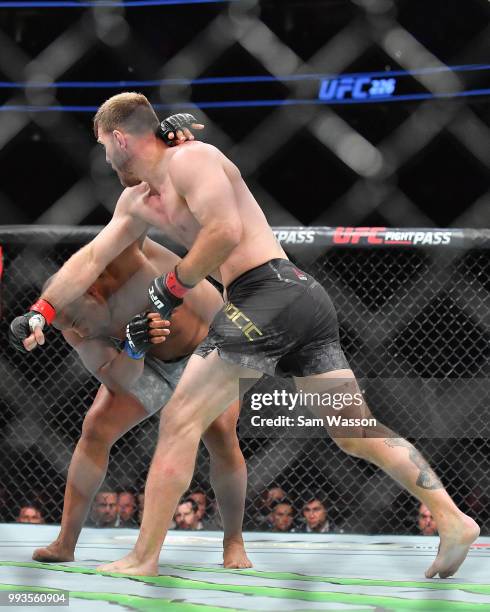 Stipe Miocic throws a punch against Daniel Cormier during their heavyweight championship fight at T-Mobile Arena on July 7, 2018 in Las Vegas,...