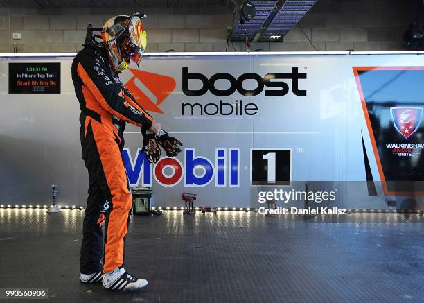 James Courtney driver of the Mobil 1 Boost Mobile Racing Holden Commodore ZB looks on during the top ten shoot out for race Lee Holdsworth of the...