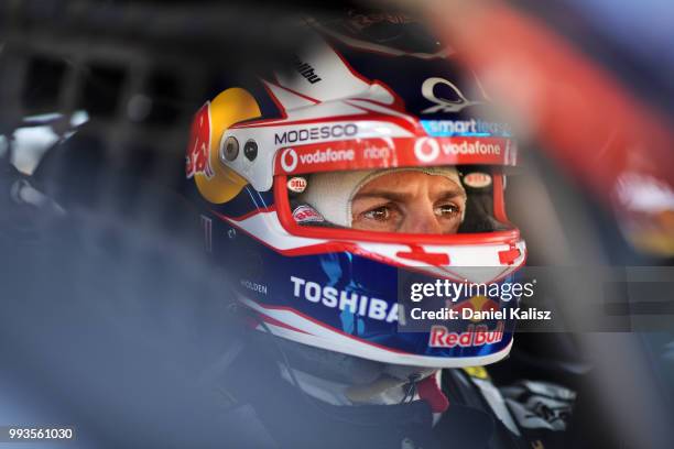 Jamie Whincup driver of the Red Bull Holden Racing Team Holden Commodore ZB looks on during the top ten shoot out for race 18 of the Supercars...