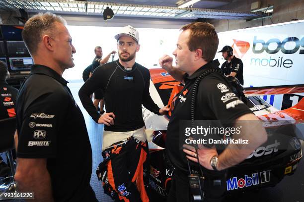 Scott Pye driver of the Mobil 1 Boost Mobile Racing Holden Commodore ZB looks on during the top ten shoot out for race Lee Holdsworth of the...