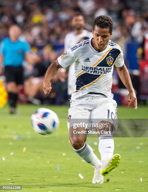 Giovani dos Santos of Los Angeles Galaxy crosses the ball during the Los Angeles Galaxy's MLS match against Columbus Crew at the StubHub Center on...