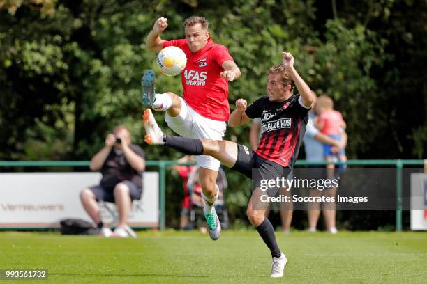 Mats Seuntjens of AZ Alkmaar, Jakob Poulsen of FC Midtjylland during the Club Friendly match between AZ Alkmaar v FC Midtjylland at the VV Dirkshorn...