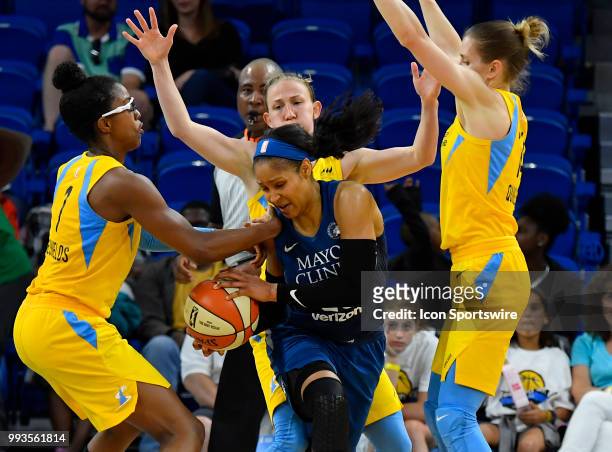 Minnesota Lynx forward Maya Moore and Chicago Sky guard Diamond DeShields battle for the ball on July 7, 2018 at the Wintrust Arena in Chicago,...