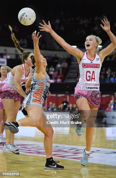 Charlee Hodges of the Thunderbirds intercepts a pass to Madi Robinson of the Magpies during the round 10 Super Netball match between the Thunderbirds...