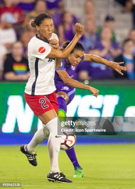 Orlando Pride forward Marta gets her shot on goal blocked by Washington Spirit defender Estelle Johnson during the NWSL soccer match between the...