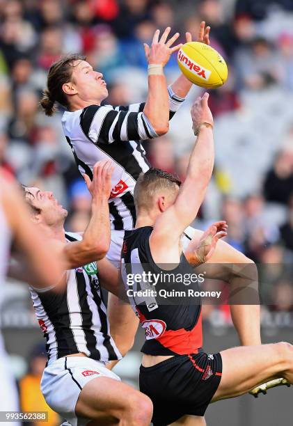 Tom Langdon of the Magpies marks during the round 16 AFL match between the Essendon Bombers and the Collingwood Magpies at Melbourne Cricket Ground...