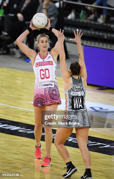 Leana de Bruin of the Thunderbirds looks to pass over Madi Robinson of the Magpies during the round 10 Super Netball match between the Thunderbirds...