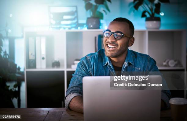 cracking codes is my speciality - happy businessman working at his office with laptop stock pictures, royalty-free photos & images