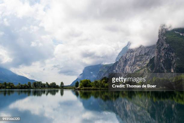 mountainous lake reflection - de boer stock pictures, royalty-free photos & images