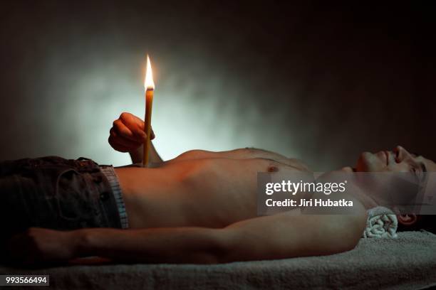 man, 24 years, with a body candle - 20 24 years photos foto e immagini stock