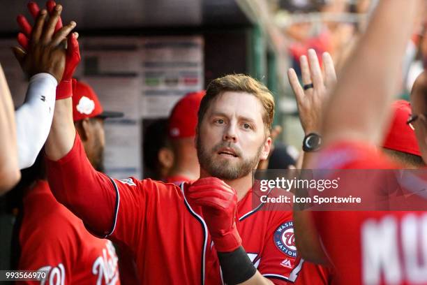 Washington Nationals first baseman Mark Reynolds is congratulated in the dugout after hitting a two run home run in the second inning during the game...