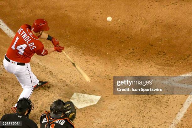 Washington Nationals first baseman Mark Reynolds hits an RBI single in the fifth inning during the game between the Miami Marlins and the Washington...