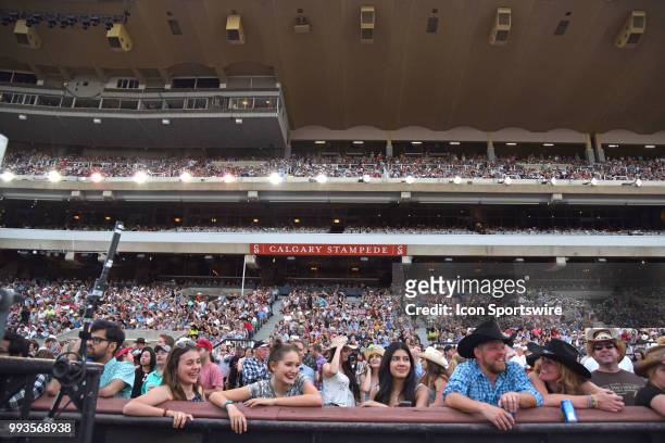 The crowd watches the GMC Rangeland Derby Chuckwagon Races at the Calgary Stampede on July 6, 2018 at Stampede Park in Calgary, AB.