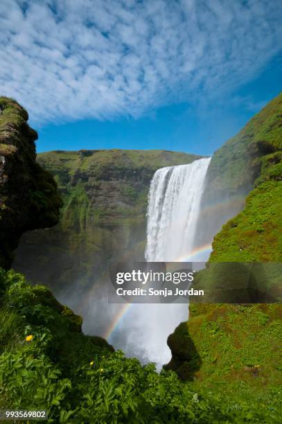 rainbow, waterfall, skogafoss the river skoga, sudurland, iceland - rainbow waterfall stock pictures, royalty-free photos & images