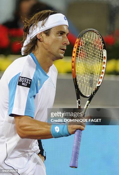 David Ferrer of Spain reacts during his game against British Andy Murray in their Madrid Masters match on May 14, 2010 at the Caja Magic sports...