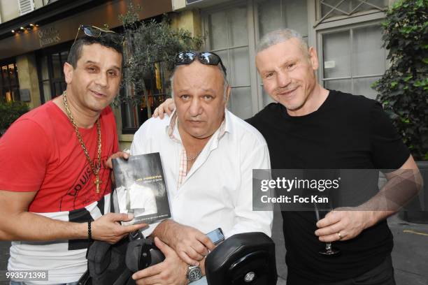 David Donadei from Citestars, Franck Tiozzo and Jo Prestia attend "Jamais A Terre" Jo Prestia Book Signing At Art Cube Galerie on July 7, 2018 in...