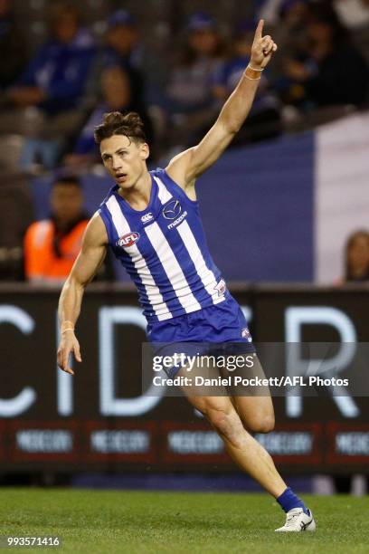 Ben Jacobs of the Kangaroos celebrates a goal during the round 16 AFL match between the North Melbourne Kangaroos and the Gold Coast Titans at Etihad...