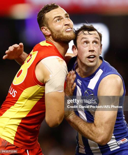 Jarrod Witts of the Suns and Todd Goldstein of the Kangaroos compete in the ruck during the round 16 AFL match between the North Melbourne Kangaroos...