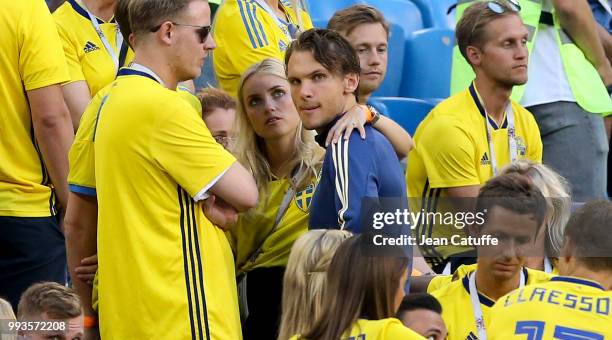 Albin Ekdal of Sweden is consoled by girlfriend Camilla Sjodahl-Essen following the 2018 FIFA World Cup Russia Quarter Final match between Sweden and...