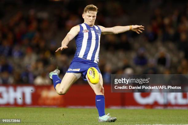 Jack Ziebell of the Kangaroos kicks the ball during the round 16 AFL match between the North Melbourne Kangaroos and the Gold Coast Titans at Etihad...