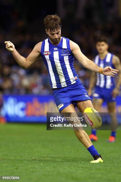 Luke McDonald of the Kangaroos kicks the ball during the round 16 AFL match between the North Melbourne Kangaroos and the Gold Coast Suns at Etihad...