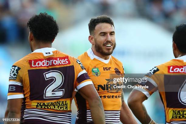 Darius Boyd of the Broncos celebrates a try during the round 17 NRL match between the Gold Coast Titans and the Brisbane Broncos at Cbus Super...