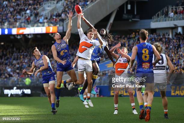 Rory Lobb of the Giants and Nic Naitanui of the Eagles contest the ruck during the round 16 AFL match between the West Coast Eagles and the Greater...