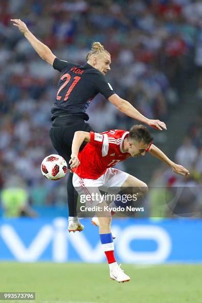 Croatian Vs. Russian Aleksandr Golovin of Russia and Domagoj Vida of Croatia battle for ...
