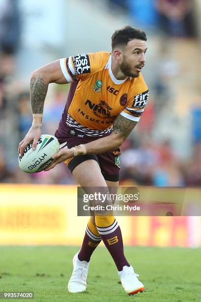 Darius Boyd of the Broncos passes during the round 17 NRL match between the Gold Coast Titans and the Brisbane Broncos at Cbus Super Stadium on July...