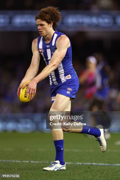 Ben Brown of the Kangaroos kicks the ball during the round 16 AFL match between the North Melbourne Kangaroos and the Gold Coast Suns at Etihad...