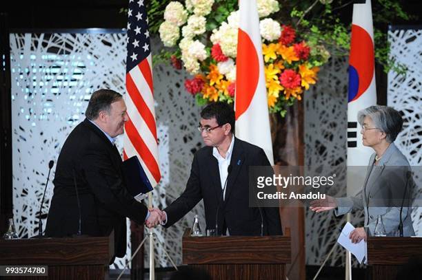 Secretary of State Mike Pompeo , Japan's Foreign Minister Taro Kono and South Korean Foreign Minister Kang Kyung Wha shake hands at the end of the...