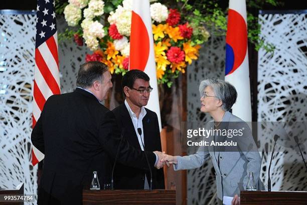 Secretary of State Mike Pompeo , Japan's Foreign Minister Taro Kono and South Korean Foreign Minister Kang Kyung Wha shake hands at the end of the...