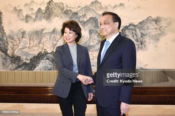 Chinese Prime Minister Li Keqiang and U.S. Transport Secretary Elaine Chao shake hands at the Zhongnanhai leadership compound in Beijing on April, 26...