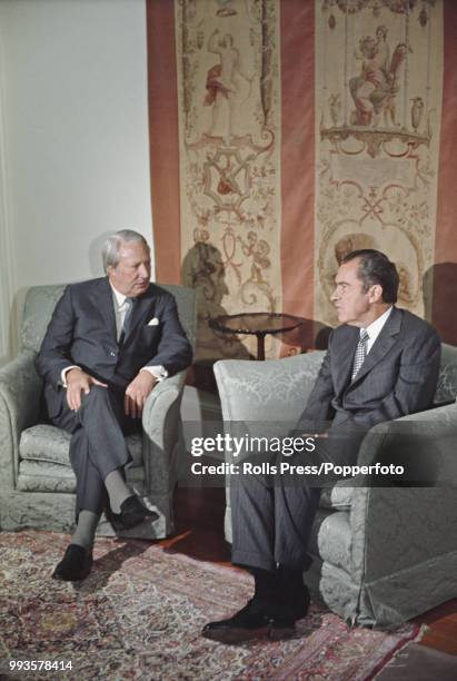 President of the United States, Richard Nixon pictured on right with Prime Minister of the United Kingdom, Edward Heath during a summit meeting and...