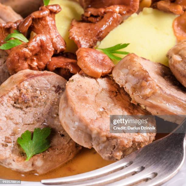 mashed potatoes with pork medallions and chanterelle sauce - mashed stock pictures, royalty-free photos & images