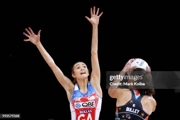 Helen Housby of the Swifts defends against Bec Bulley of the Giants during the round 10 Super Netball match between the Giants and the Swifts at the...