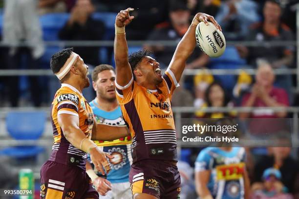 Jonus Pearson of the Broncos celebrates a try during the round 17 NRL match between the Gold Coast Titans and the Brisbane Broncos at Cbus Super...