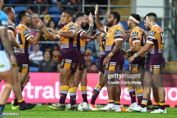 Jonus Pearson of the Broncos celebrates a try during the round 17 NRL match between the Gold Coast Titans and the Brisbane Broncos at Cbus Super...