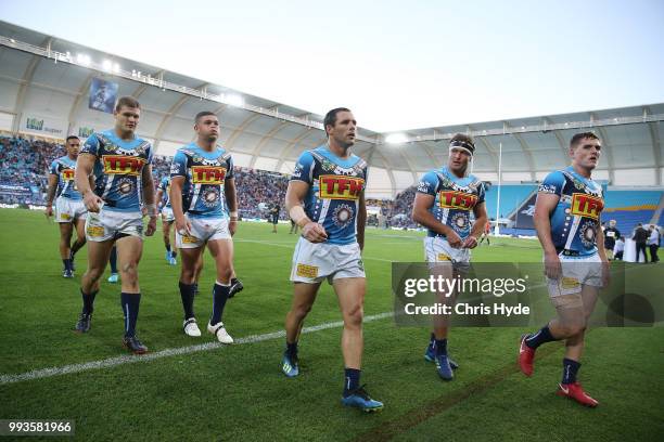 Titans leave the field at half time during the round 17 NRL match between the Gold Coast Titans and the Brisbane Broncos at Cbus Super Stadium on...