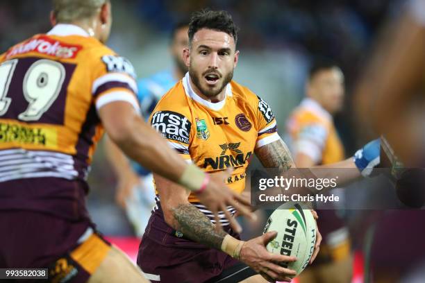 Darius Boyd of the Broncos passes during the round 17 NRL match between the Gold Coast Titans and the Brisbane Broncos at Cbus Super Stadium on July...