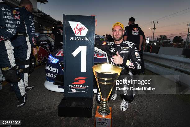 Shane Van Gisbergen driver of the Red Bull Holden Racing Team Holden Commodore ZB celebrates after winning race 18 of the Supercars Townsville 400 on...