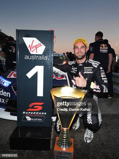 Shane Van Gisbergen driver of the Red Bull Holden Racing Team Holden Commodore ZB celebrates after winning race 18 of the Supercars Townsville 400 on...