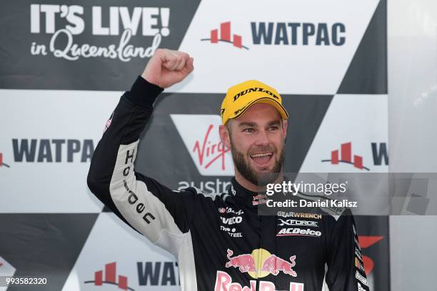 Shane Van Gisbergen driver of the Red Bull Holden Racing Team Holden Commodore ZB celebrates after winning race 18 of the Supercars Townsville 400 on...