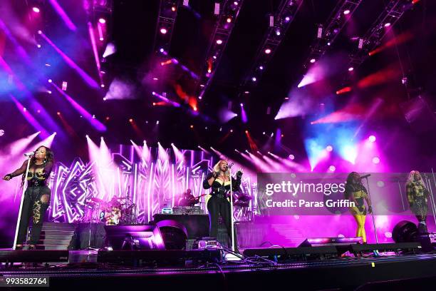 Kandi Burruss, Tamika Scott, Tameka "Tiny" Harris and LaTocha Scott of Xscape perform onstage during the 2018 Essence Festival -Day 2 at Louisiana...