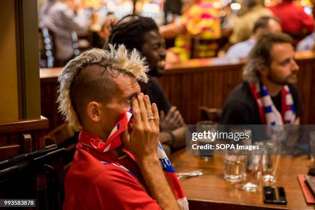 Russian football fan reacts, after Croatia scored a second goal, while watching the 2018 World Cup game at the Uptown Cafe. Russian lost to Croatia...