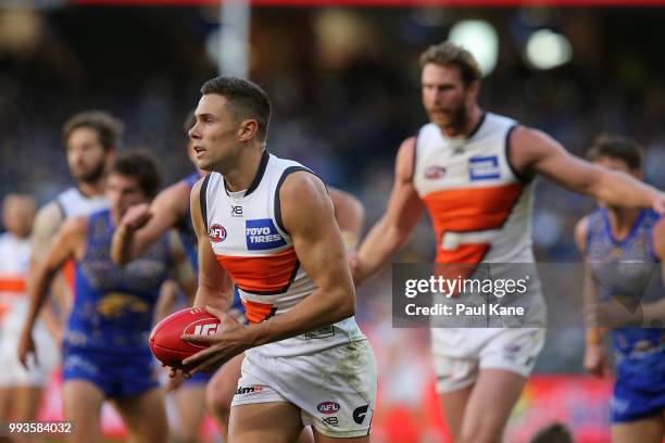 Josh Kelly of the Giants looks to pass the ball during the round 16 AFL match between the West Coast Eagles and the Greater Western Sydney Giants at...